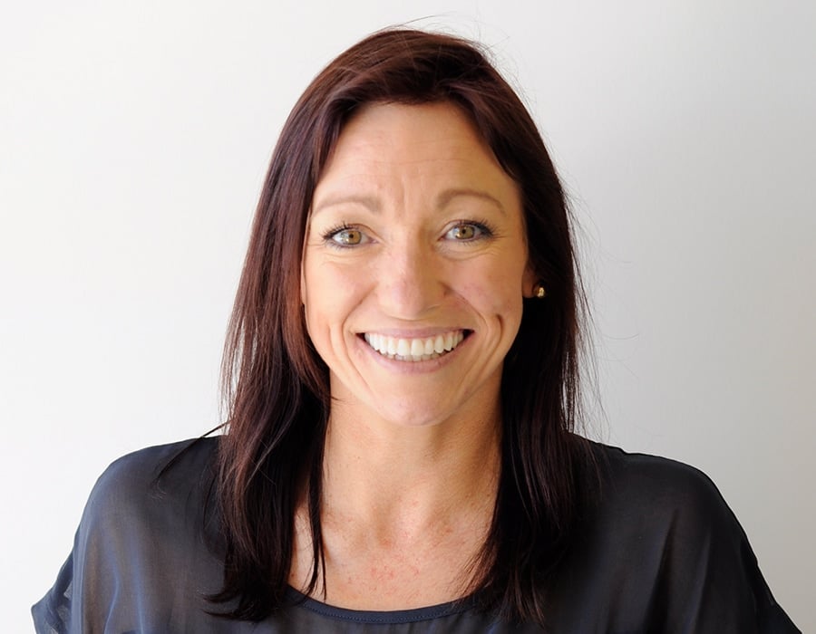 woman smiling after All on 4 dental implants