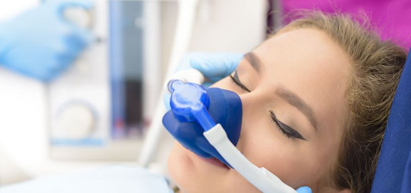woman under anesthesia at dentist